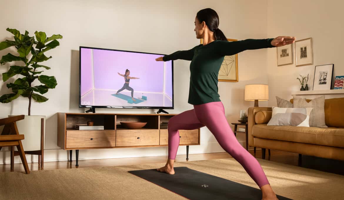 Women working out infront of her TV