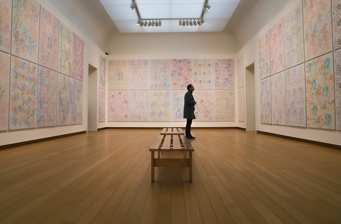 Patron looking at art in a modern gallery