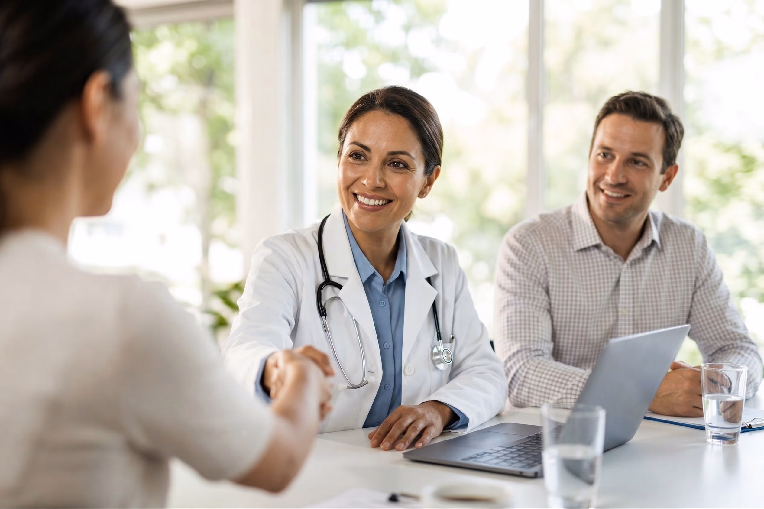 Doctor shaking hand with patient
